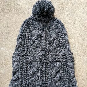 Grey crocheted pompom beanie